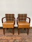 Pair of tan leather and check fabric chairs