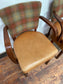 Pair of tan leather and check fabric chairs