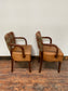 Pair of tan leather and check fabric chairs