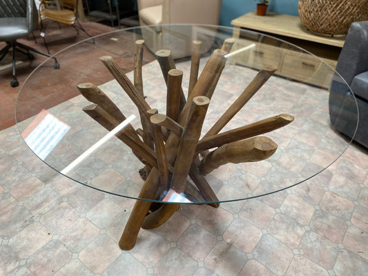 Round glass table with wooden branch base