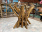 Round glass table with wooden branch base