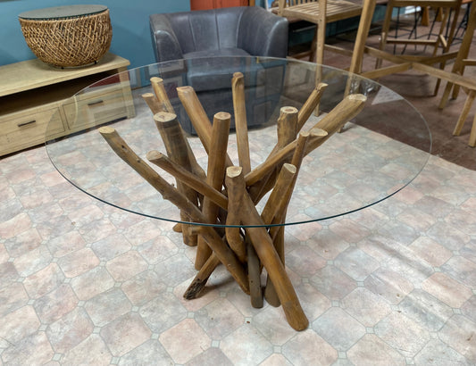 Round glass table with wooden branch base