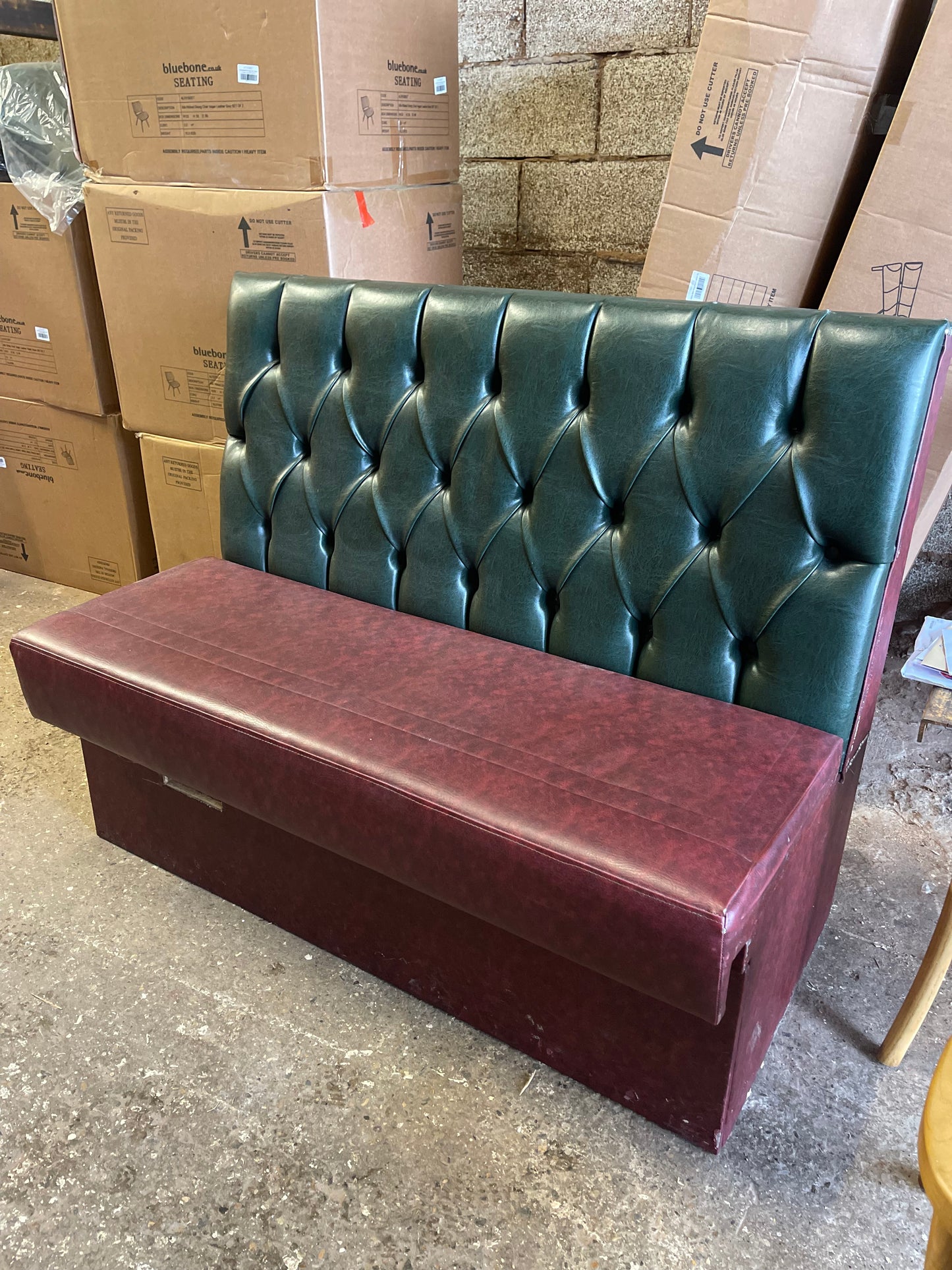 Single fixed seating pub bench in red green faux-leather