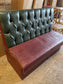 Single fixed seating pub bench in red green faux-leather