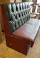 Single fixed seating pub bench in red green faux-leather