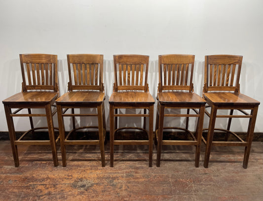 Set of five wooden pub bar stools with backrests