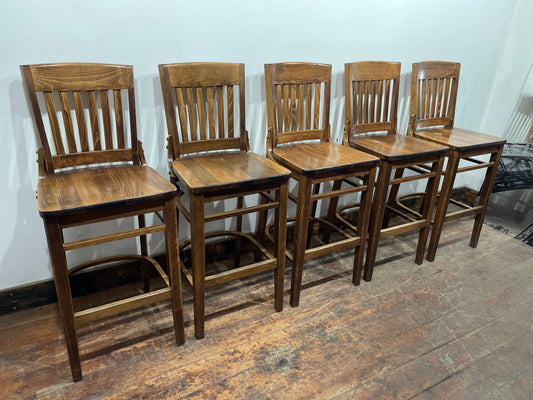 Set of five wooden pub bar stools with backrests