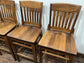 Set of five wooden pub bar stools with backrests