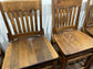 Set of five wooden pub bar stools with backrests
