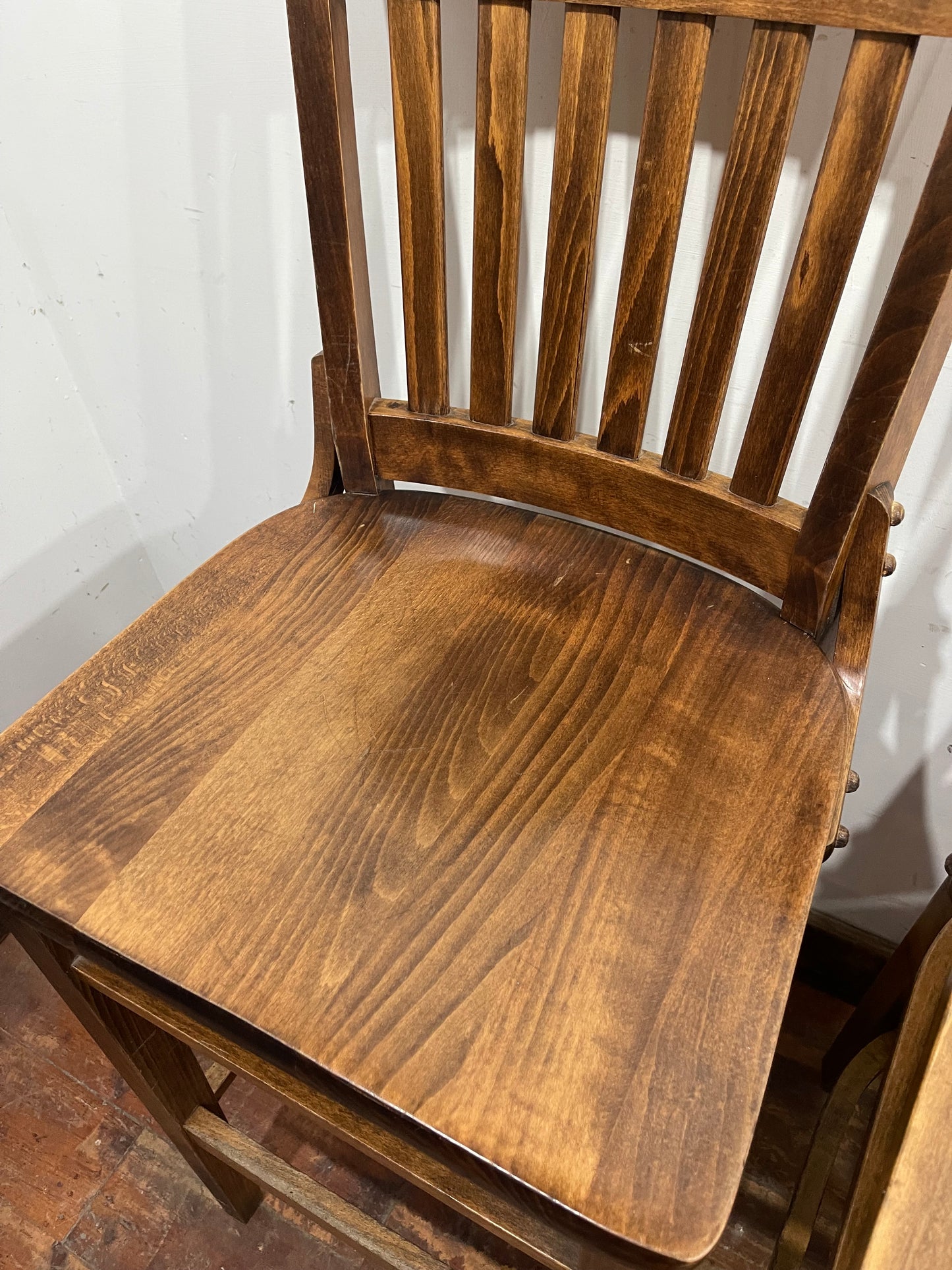 Set of five wooden pub bar stools with backrests