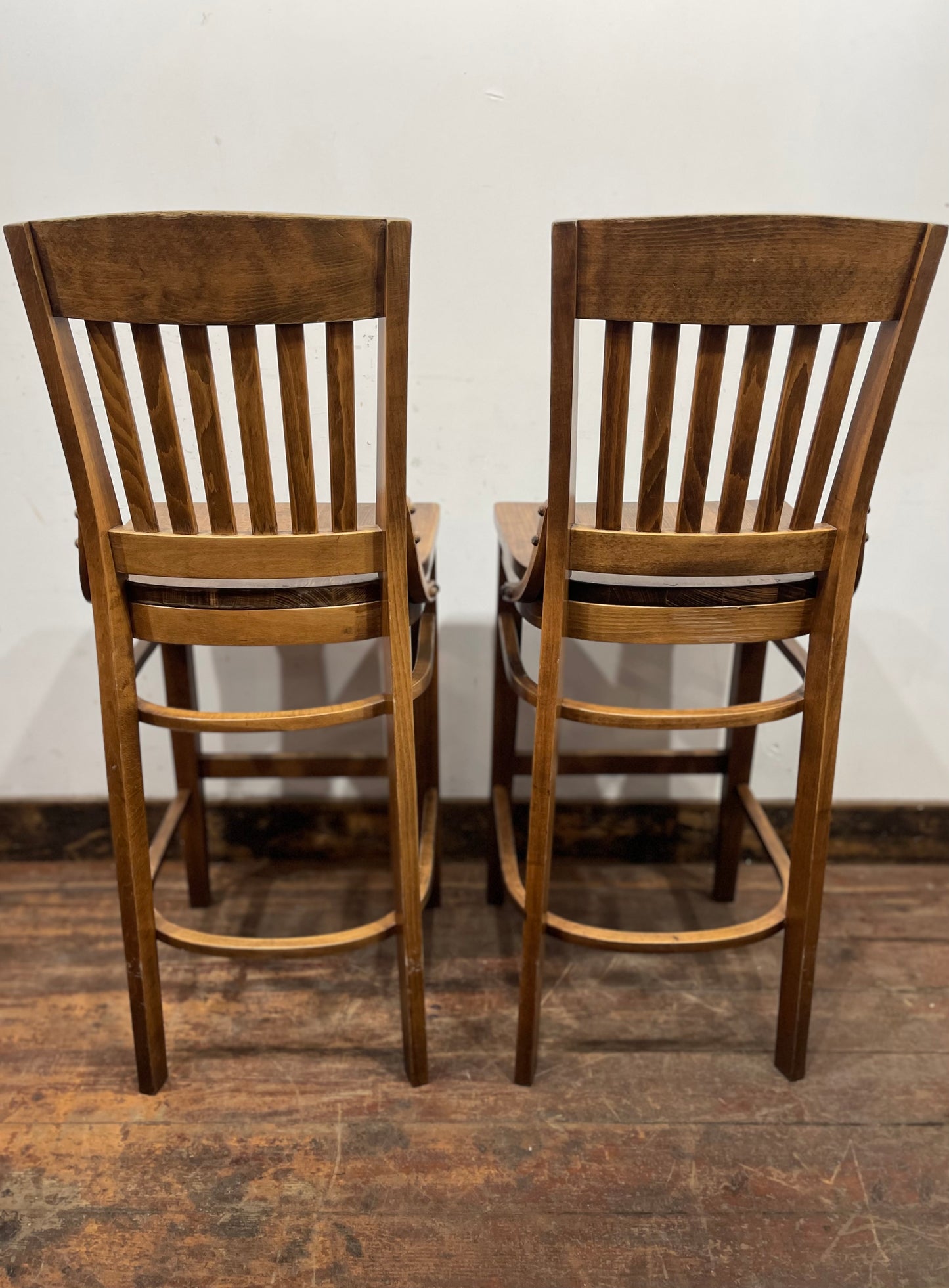 Set of five wooden pub bar stools with backrests