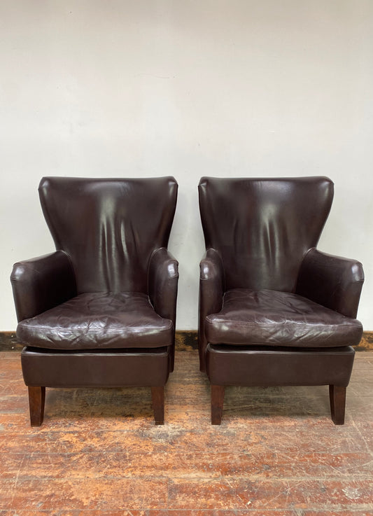 Pair of matching leather wingback armchairs
