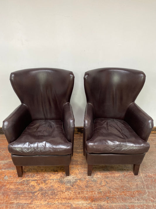 Pair of matching leather wingback armchairs