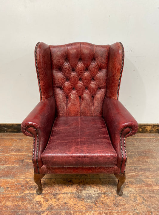Stunning red leather wingback armchair