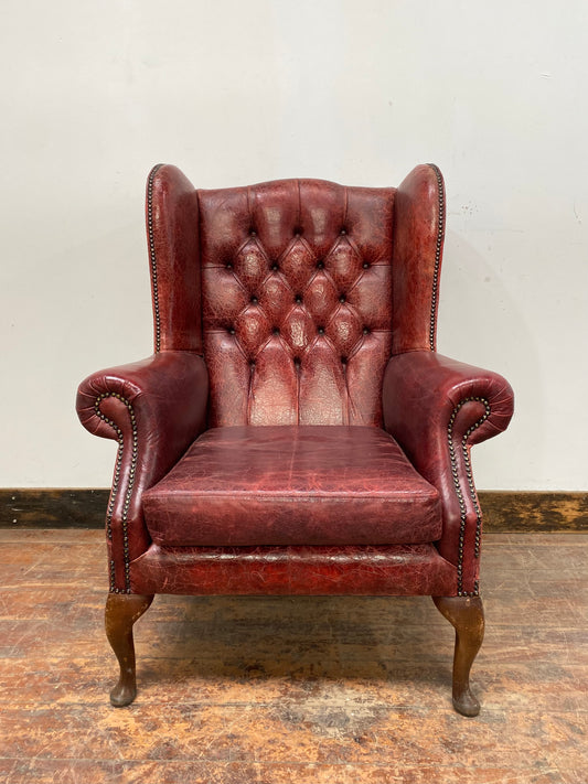 Stunning red leather wingback armchair