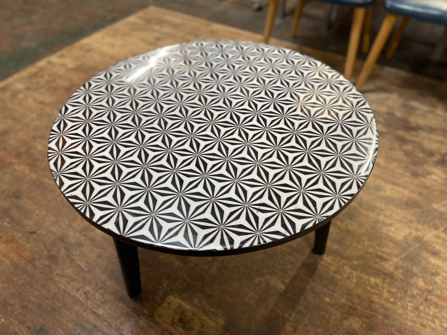 Black and white round coffee table with graphic print