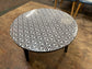 Black and white round coffee table with graphic print
