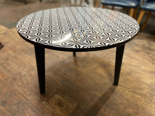 Black and white round coffee table with graphic print