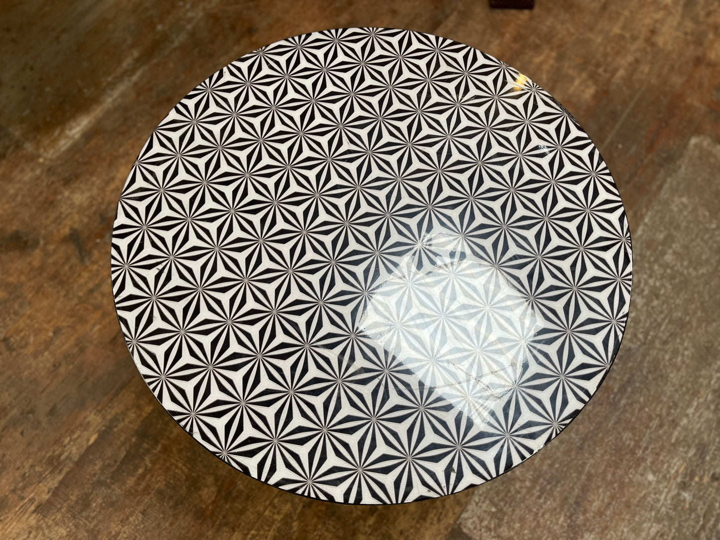Black and white round coffee table with graphic print