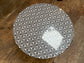 Black and white round coffee table with graphic print