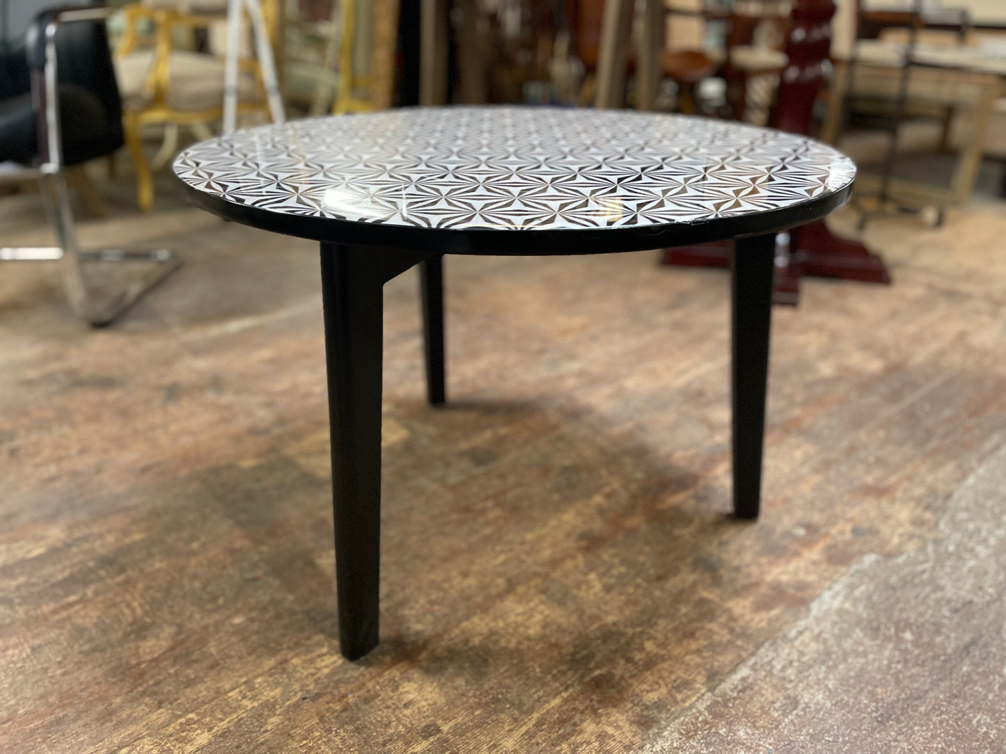 Black and white round coffee table with graphic print