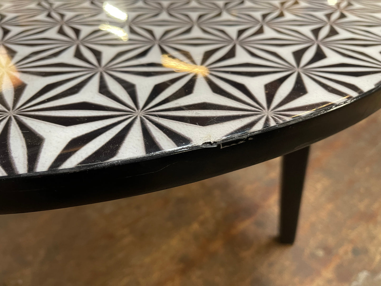 Black and white round coffee table with graphic print