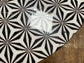 Black and white round coffee table with graphic print