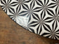Black and white round coffee table with graphic print