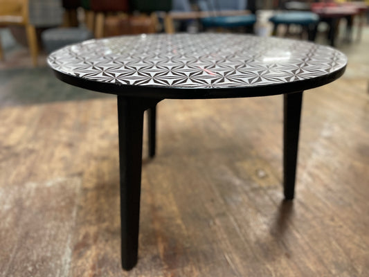 Black and white round coffee table with graphic print