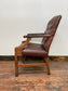 Brown leather armchair with wood frame