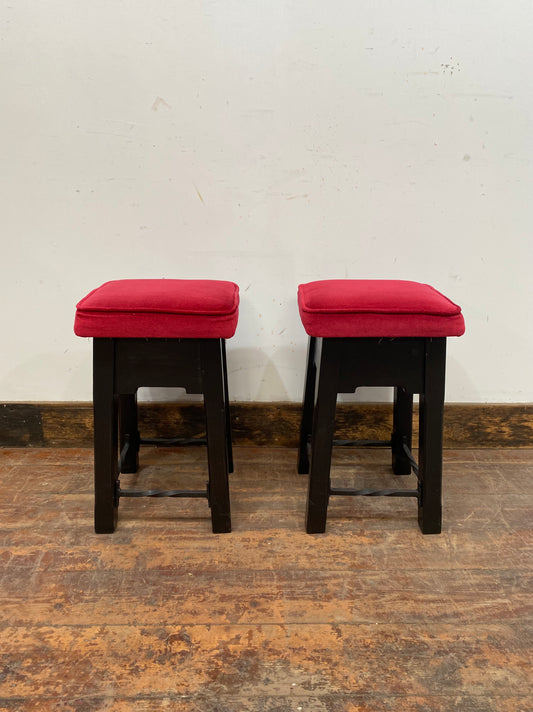 Low bar stools with red velvet-feel tops
