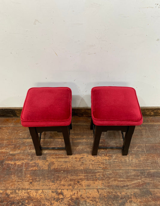 Low bar stools with red velvet-feel tops