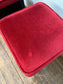 Low bar stools with red velvet-feel tops