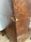 Wingback armchair in brown leather