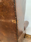 Wingback armchair in brown leather