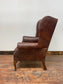 Wingback armchair in brown leather