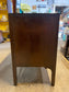 Small vintage chest of drawers in dark wood