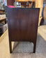 Small vintage chest of drawers in dark wood