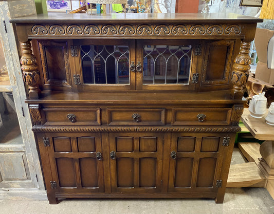Antique solid oak tall sideboard / cabinet with ornate carvings
