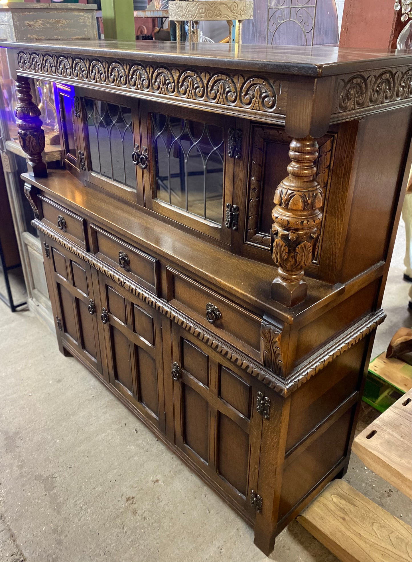 Antique solid oak tall sideboard / cabinet with ornate carvings
