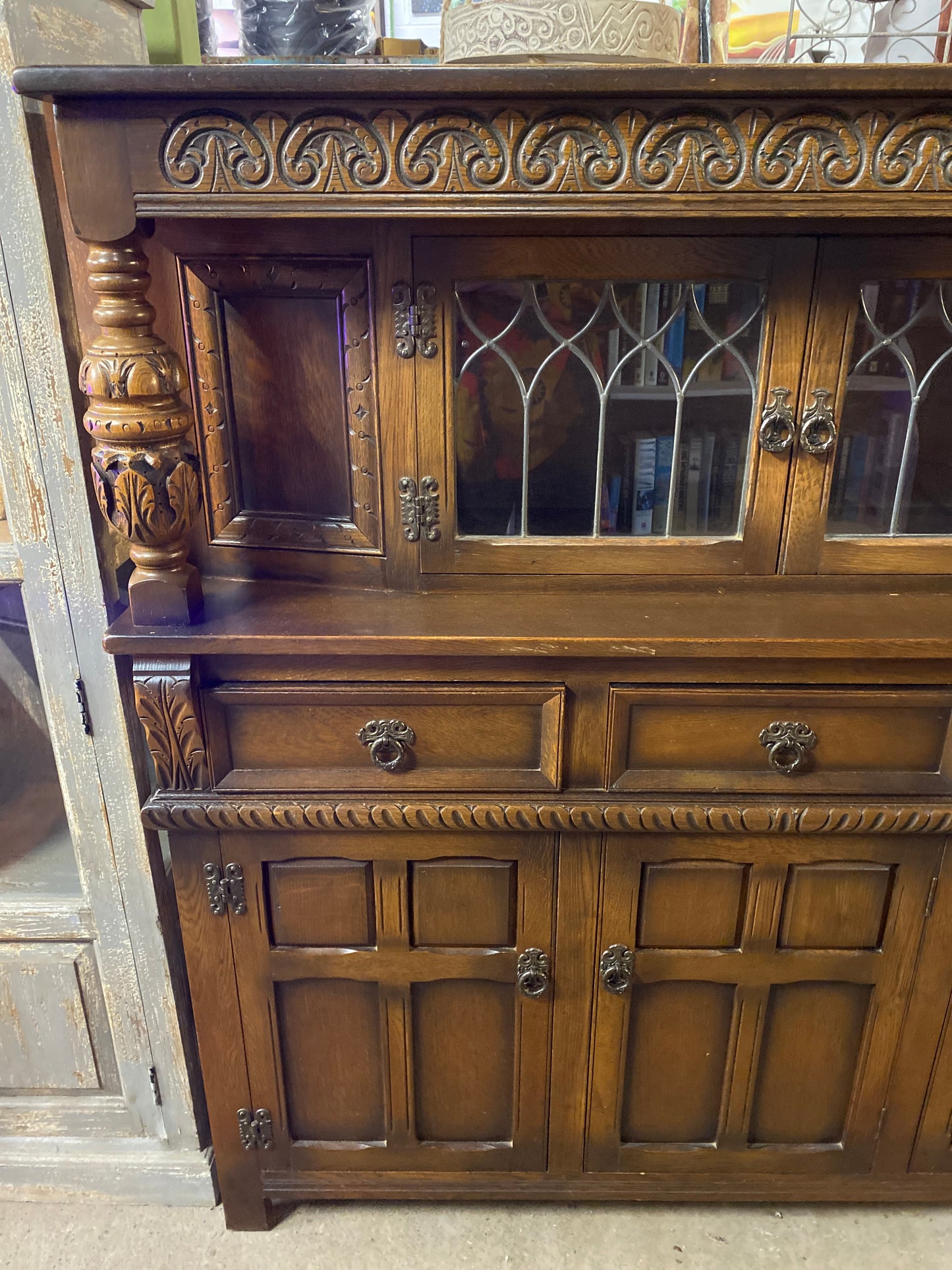 Antique solid oak tall sideboard / cabinet with ornate carvings