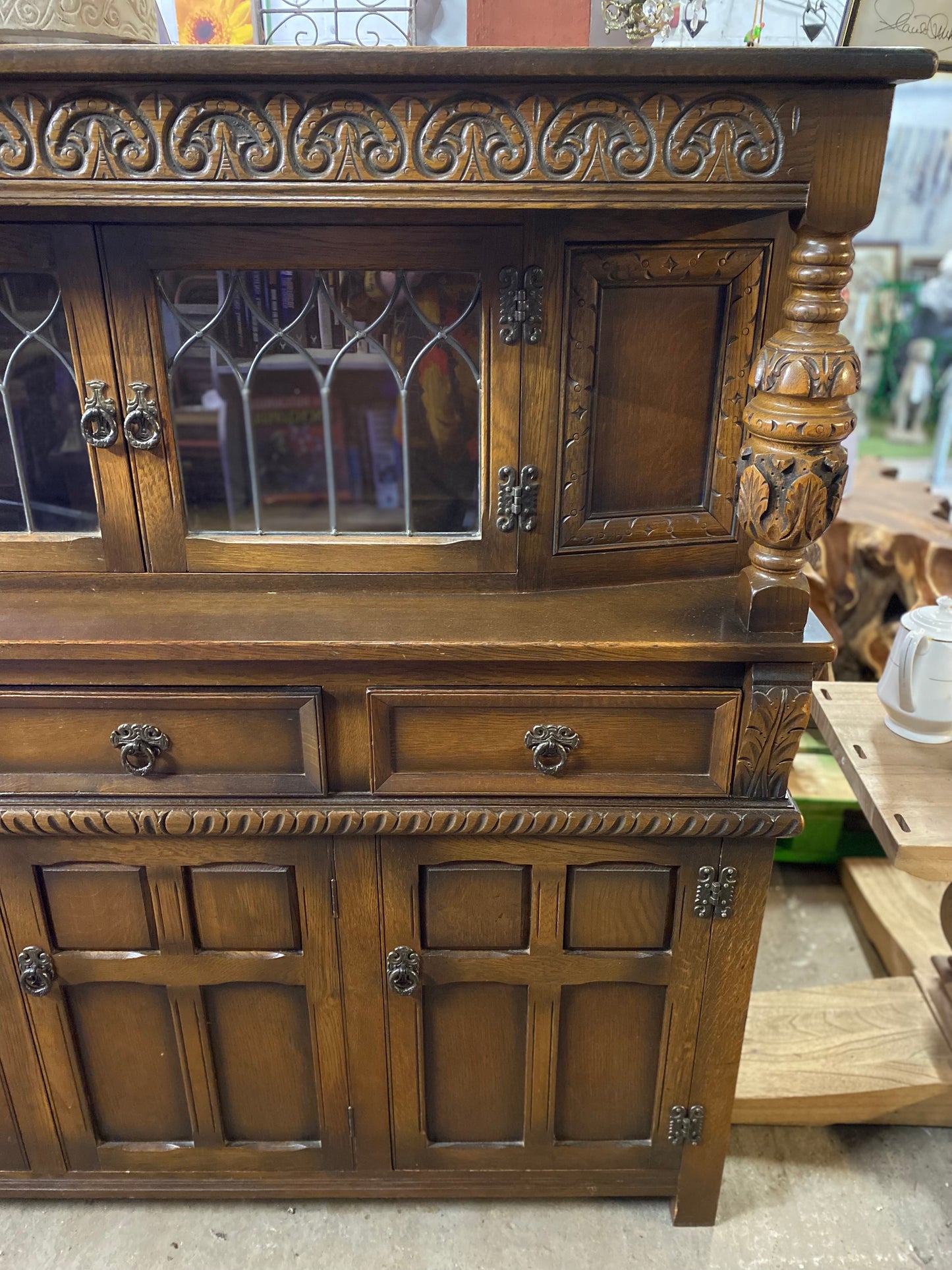 Antique solid oak tall sideboard / cabinet with ornate carvings