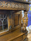 Antique solid oak tall sideboard / cabinet with ornate carvings