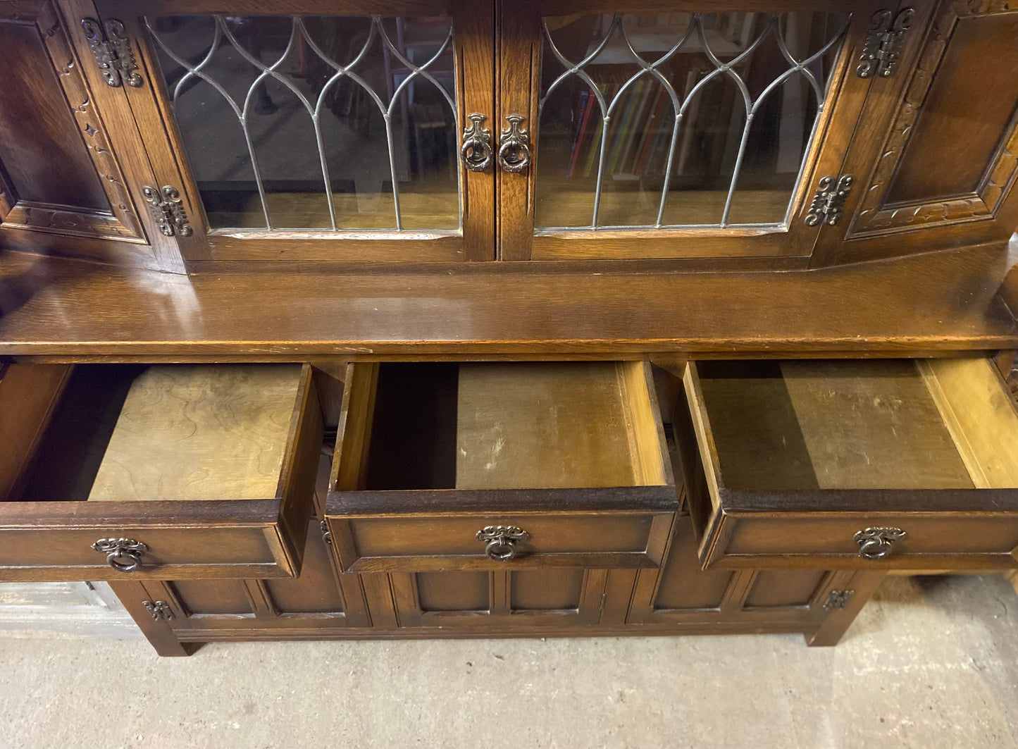 Antique solid oak tall sideboard / cabinet with ornate carvings