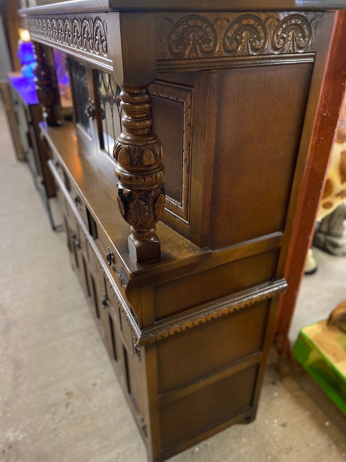 Antique solid oak tall sideboard / cabinet with ornate carvings