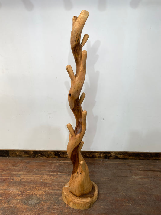 Tree trunk coat stand