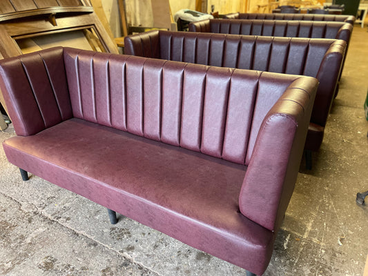 Long burgundy pub / bar / cafe bench in faux-leather