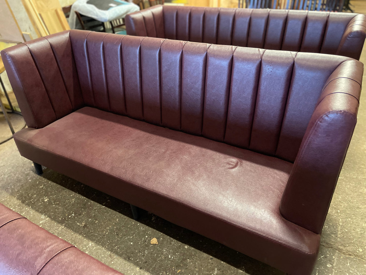 Long burgundy pub / bar / cafe bench in faux-leather