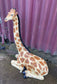 Small sitting giraffe figure / statue suitable indoors or outdoors