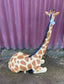 Small sitting giraffe figure / statue suitable indoors or outdoors